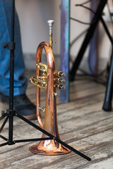 Fototapeta na wymiar Vintage trumpet stands on a stage