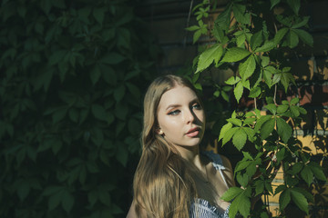 Fototapeta premium portrait of young woman in spring garden