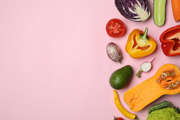 Flat lay composition with fresh ripe vegetables on color background. Space for text
