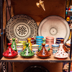 Traditional Moroccan marrakech market with plates and tajin tagine. Handmade ceramic plates....