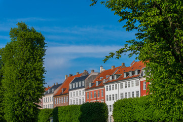 Scenic summer view of the ancient classic colorful houses with blue sky in Copenhagen, Denmark