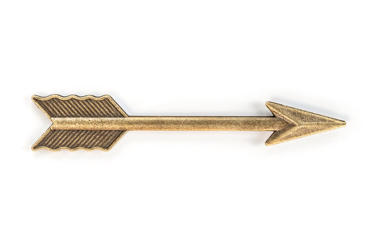 Brass arrow on white background. Clipping path. Close up of a bronze arrow signaling