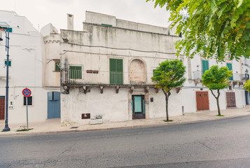 View of the old town of Martina Franca with a beautiful houses painted in white.