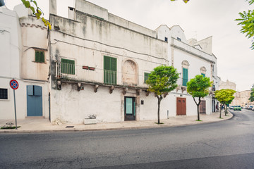 View of the old town of Martina Franca with a beautiful houses painted in white.