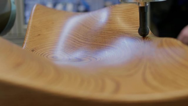Contact 3D scanner arm collecting data of surface relief for constructing digital solid model, few shots. Automated articulated arm with rigid bones and high precision angular sensors moving over wood
