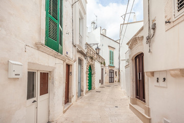 Fototapeta na wymiar View of the old town of Martina Franca with a beautiful houses painted in white.