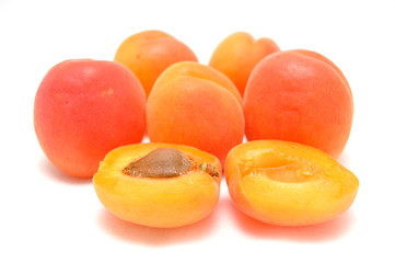 Ripe apricot on white background close-up