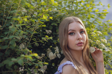 portrait of young woman in spring garden