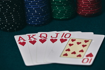 Poker Hands / Royal Flush 3. Five playing cards - the poker royal flush hand. Royal Flash,red card deck, poker royal flash on cards and poker chips on green casino table. success in gambling.