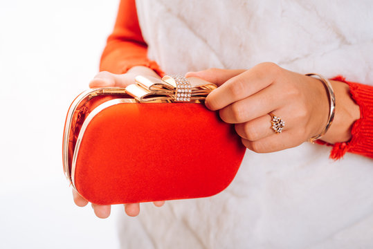 Carry your lippy in style. Mini bag. Fashion handbag. Fashion accessory. Vintage or retro clutch design. Red purse or pouch. Box clutch. Hand bag designed with rhinestones. Clutch bag in female hands
