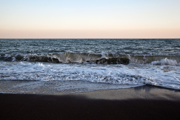 Fototapeta na wymiar Sea surf at sunset
