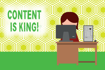 Text sign showing Content Is King. Business photo showcasing marketing focused growing visibility non paid search results Young female working office sitting desktop computer office monitor photo