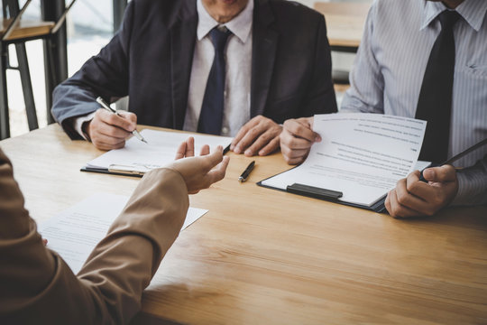 Business woman explaining about his profile to two selection committee manager sitting in during job Interview, interview the job and hiring
