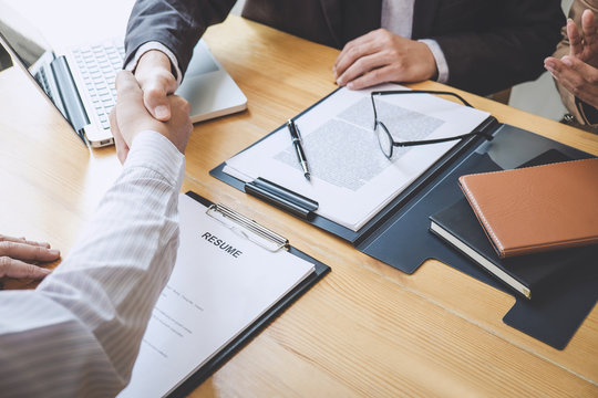 Greeting New Colleagues, Handshake While Job Interviewing, Male Candidate Shaking Hands With Interviewer Or Employer After A Job Interview, Employment And Recruitment Concept