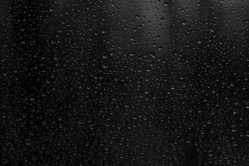 Water raindrops droplets on black background
