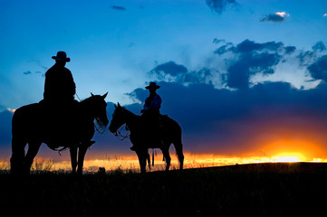 Two cowboys at dawn
