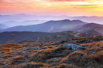 Panorama with interesting sunrise enlightens surroundings. Landscape with beautiful mountains and...