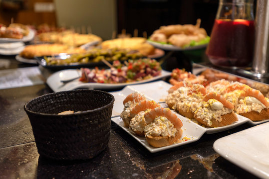 Servings of various pintxos or tapas at a bar in San Sebastian, Spain