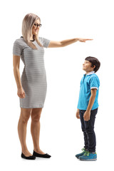 Woman gesturing with hand and showing the height of a young boy