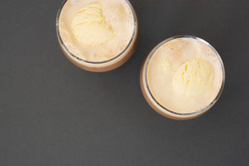 Coffee cold drink with ice cream and espresso. Affogato deliciouse summer refreshing drink in glass. Top view, copy space.