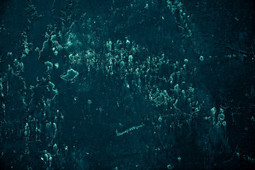 Vintage azure background. Rough painted wall of turquoise color. Imperfect plane of cyan colored. Uneven old decorative toned backdrop of aqzure tint. Texture of teal hue. Ornamental stony surface.