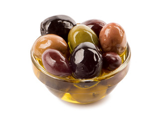 Bowl of different types of olives and olive oil