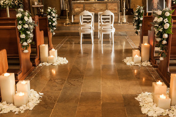 Catholic temple decorated with flowers and candles for wedding