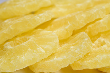 Yellow pineapple sweets, cut into round slices.