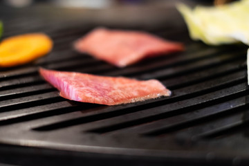 Grilled Hida beef on stove in Takayama, Japan.