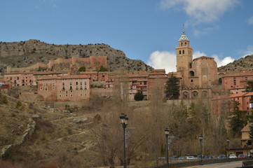 Fototapeta na wymiar December 28, 2013. Albarracin, Teruel, Aragon, Spain. Views Of The Villa With The Savior Cathedral And Its Hanging Houses On A Mountain. History, Travel, Nature, Landscape, Vacation, Architecture.
