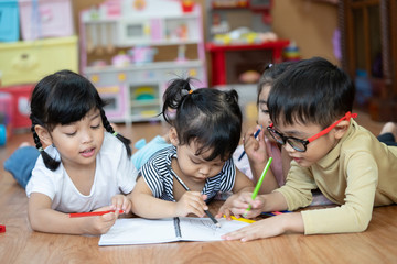 Kid Asian student doing homework .Kid enjoy learning with happiness at home. Education concept   