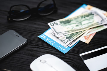 On the wooden black table tickets are your credit card points and travel concept
