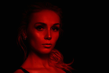 High Fashion model girl in colorful bright sparkles and neon lights posing in studio, portrait of beautiful sexy woman, trendy glowing make-up. Art design colorful make up. Glitter Vivid neon makeup