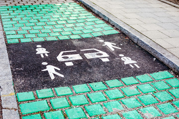 Car sharing vehicle parking sign on asphalt road