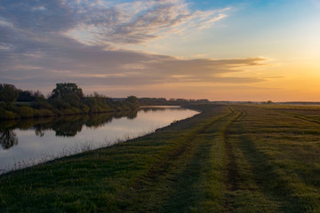 Dawn in a field near the river