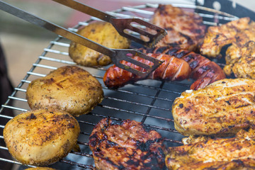 Assorted delicious grilled meat over the coals.