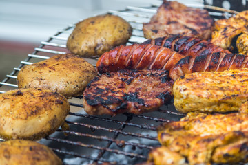 Assorted delicious grilled meat over the coals.