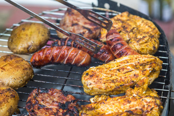 Assorted delicious grilled meat over the coals.