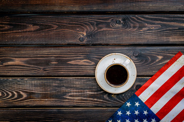 Independence day of USA with flag and cup of coffee on wooden background top view mockup
