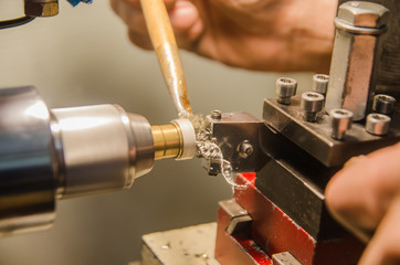 Machining of cylindrical parts on a lathe machine.