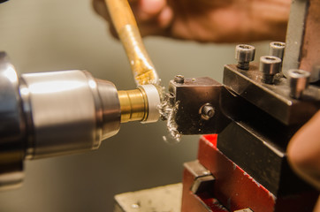 Machining of cylindrical parts on a lathe machine.