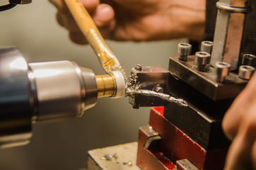 Machining of cylindrical parts on a lathe machine.