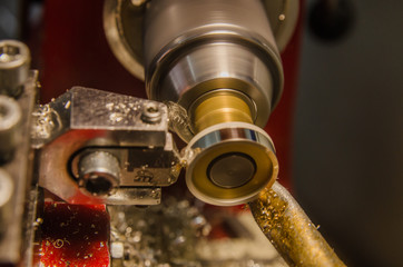 Obraz na płótnie Canvas Machining of cylindrical parts on a lathe machine.