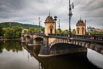 Beautiful Vltava river in Prague with old town and historical buildings in the background