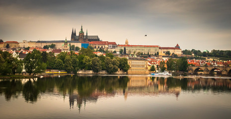 Beautiful Vltava river in Prague with old town and historical buildings in the background