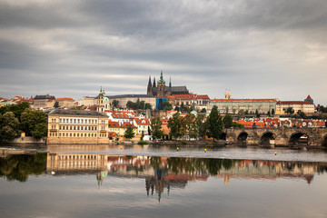 Fototapeta premium Beautiful Vltava river in Prague with old town and historical buildings in the background