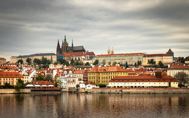 Naklejka na ściany i meble Beautiful Vltava river in Prague with old town and historical buildings in the background