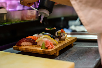 Fototapeta na wymiar preparation of japanese food including sushi and salad
