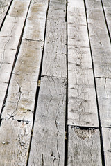 Rusty nails and raised wood decking panels