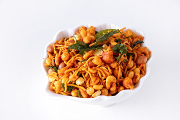 South indian spicy crunchy mix Nimco or Namkeen white bowl background isolated.